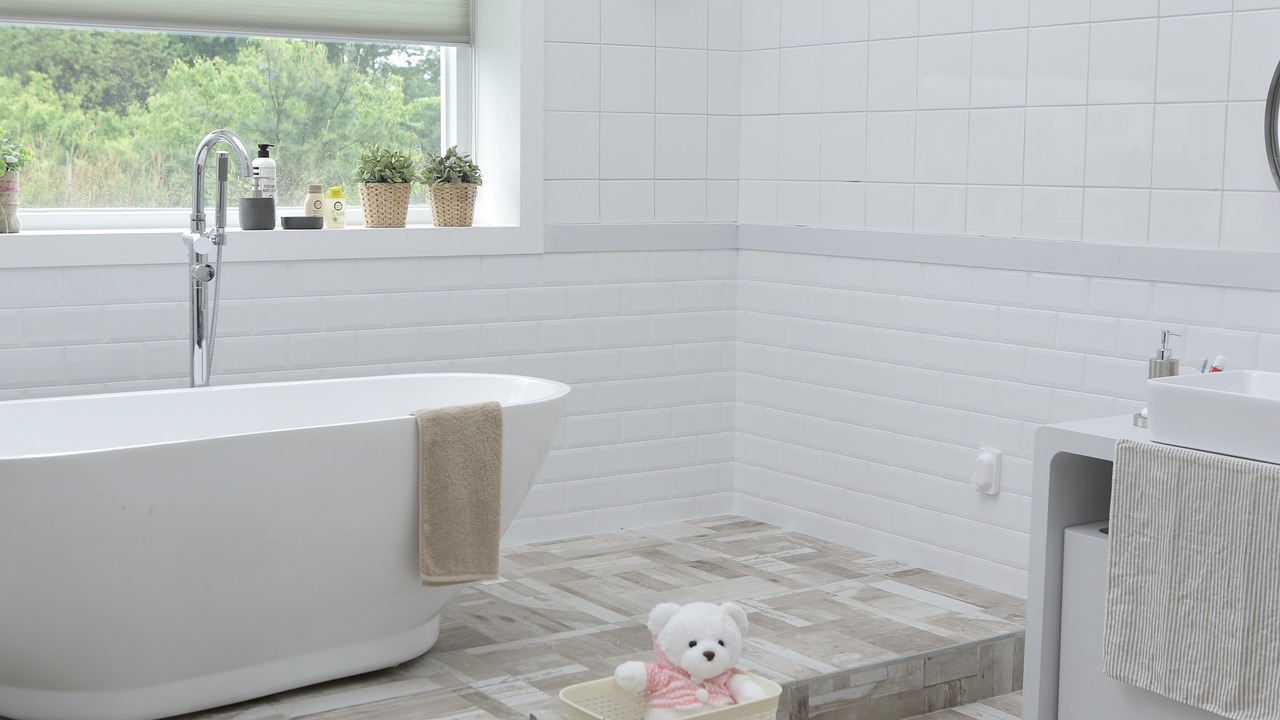 white bathroom with a soaker tub